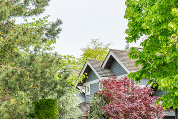 Top of luxury house with shingle roof and nice windows in Summer in Vancouver, Canada, North...