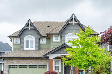 Top of luxury house with shingle roof and nice windows in Summer in Vancouver, Canada, North America. Day time on August 2025