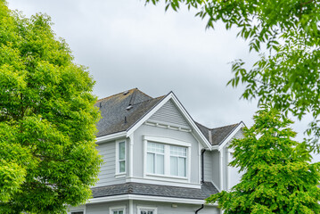 Top of luxury house with shingle roof and nice windows in Summer in Vancouver, Canada, North America. Day time on August 2025