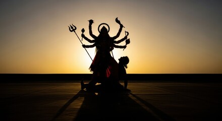 Silhouette of Goddess Durga Against a Fiery Sunset Sky