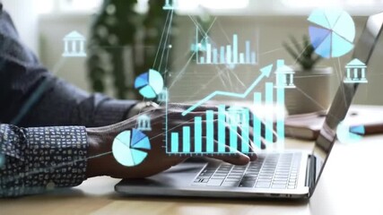African American Man Typing on Laptop with Holographic Financial Data Overlay - Powered by Adobe