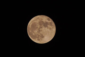 Obraz premium waxing full moon shines at night close up