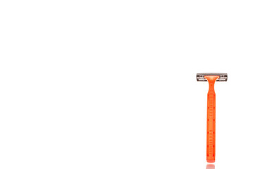 Disposable razor isolated on white background, close-up.