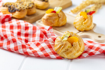 Eclair choux pastry on a white table. perfect for recipe, article, or any commercial purposes.