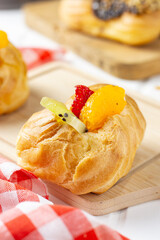 Eclair choux pastry on a white table. perfect for recipe, article, or any commercial purposes.