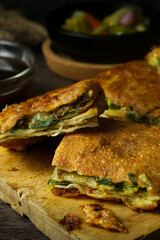 Martabak telur. Egg martabak or thick folded crepe made from egg, meat, and vegetables.