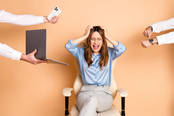 Stressed businesswoman overwhelmed by workplace demands with gestures pointing and work items in a professional setting