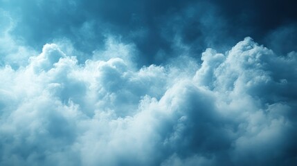 Obraz premium A Majestic Seascape of Voluminous, Sunlit Clouds in a Deep Teal Sky.