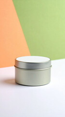 Blank round tin, soft orange and pastel green background, minimal eco design, metal container, clean, modern, packaging concept
