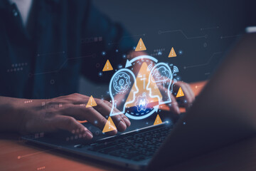 People working with laptop computers with holographic AI alert interface, conveying cyber threats, malware detection, data protection and high-tech risk management concept