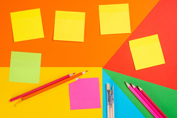 Sticky Notes and Pencils on Geometric Background