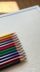 Multicolored pencils on a white background. The concept of creativity, art, and education.