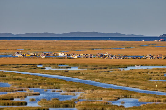 The Uros Islands are a group of artificial floating islands located on Lake Titicaca, which is situated on the border of Peru and Bolivia. The islands are home to the Uros people. Puno Peru
