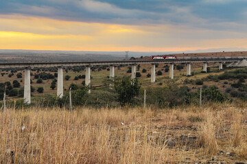 Scenic view of a cargo train on a bridge at sunset at Nairobi National Park in Nairobi City, Kenya