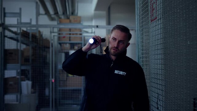 Security Guard Officer With Flashlight Protecting