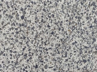Granite surface Texture: A detailed close-up showcases the raw texture and subtle patterns of a granite surface, revealing the beauty of natural stone in an abstract composition.