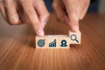 Understanding business strategy and goals setting with wooden blocks concept