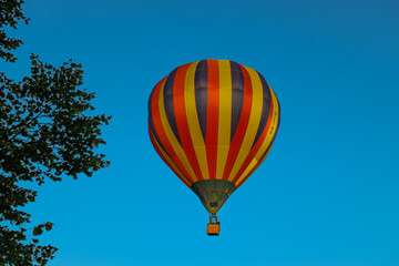 Colorful Hot Air Balloon Against Clear Blue Sky
