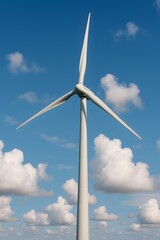 Sleek Wind Turbine Against Blue Sky with Fluffy Cloud