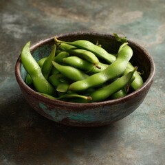 Fresh green fava beans in a rustic bowl, showcasing vibrant color and texture