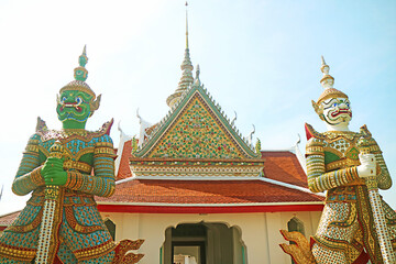 Fantastic Eastern Gate of of Wat Arun or Temple of The Dawn, Guarding with Two Mythical Giant Demon Sculptures, Bangkok, Thailand