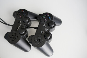 Video game controllers on light background