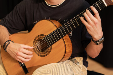 man playing acoustic guitar