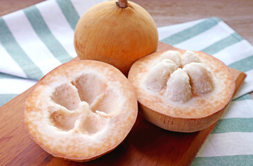 Closeup of Delectable Fresh Ripe Santol Fruit or Wild Mangosteen with a Whole Fruit