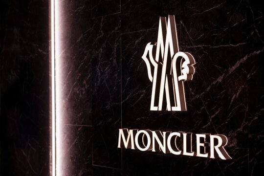 Moncler Luxury Store Logo on Black Marble Wal