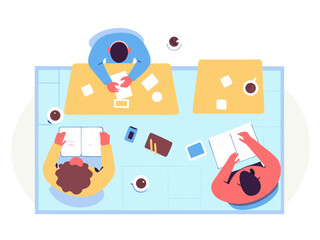 Top view of coworking space with young professionals working on laptops and documents