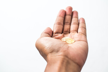 Hand holding frankincense resin, aromatic incense used in perfumes and aromatherapy