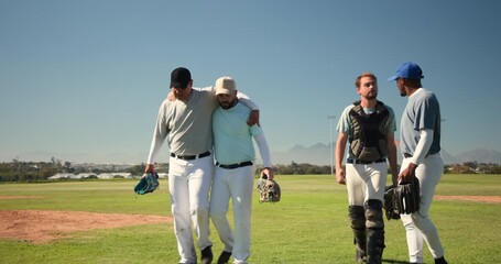 Diverse male baseball teammates helping players walking off field after drill, with gear