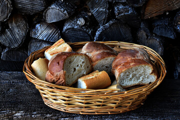 Rustic image of a wooden basket with pieces of bread