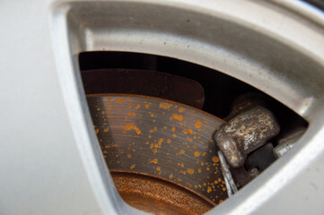 Rust buildup on the brake disc suggests that the vehicle may require maintenance and inspection at...