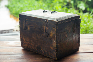 Old wooden chest on a wooden table