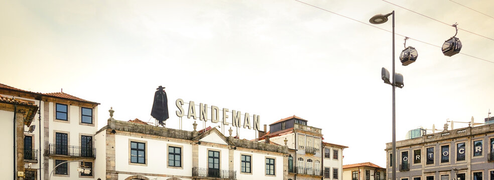 Porto, Portugal - 09-16-2024: One of the different port wine houses in Porto, portugal. Sandeman en Porto Cruz. With smoke in the air from the fires. 
