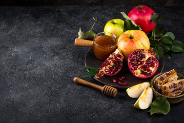 Rosh Hashana concept with honey, apple and pomegranate