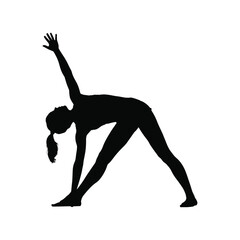 Silhouette of a woman performing a yoga triangle pose