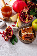 Rosh Hashana concept with honey, apple and pomegranate