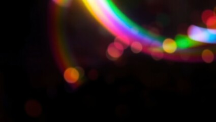 Blurred rainbow refraction overlay effect. Light lens prism effect on black background. Holographic reflection, crystal flare leak shadow overlay. Colorful rainbow disco ball light