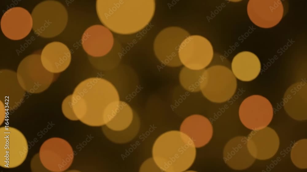 Aufkleber golden bokeh lights motion background - abstract loopable video of shimmering, out-of-focus golden a