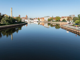 Obraz premium Panoramic view of Motława River with reflections of Gdańsk Old Town, Poland