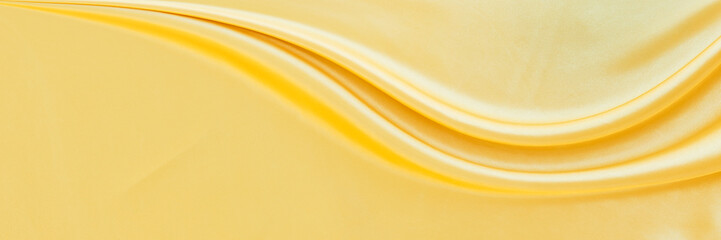 yellow gold satin texture that is white silver fabric luxurious shiny that is abstract silk cloth...