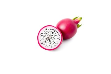 One whole  one halved dragon fruit deep pink showing pulp speckled with tiny black seeds green leaves on whole fruit