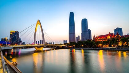 Obraz premium City skyline at dusk with bridge over river