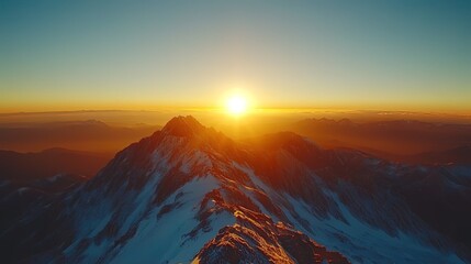 Aerial View of Mountain Peak at Sunrise with Sun and Horizon in Background 