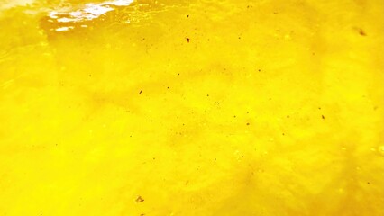 bright golden yellow textured fruit pulp closeup with soft juicy surface for tropical food background or citrus inspired design