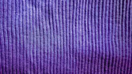 rich purple corduroy fabric with vertical textured ribbing ideal for fashion textile backgrounds and upholstery design