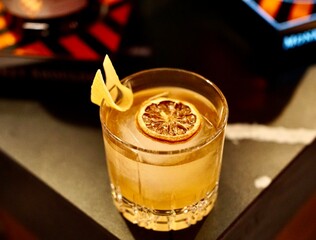 cocktail with garnish on a table | bar mood