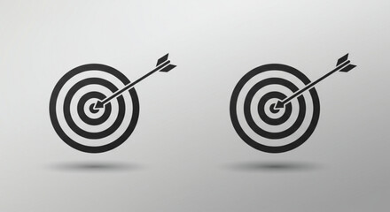 Black target with arrow hitting the center on gray, success and accuracy